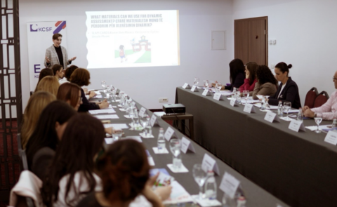 Charlotte Hilker lectures in a classroom in Kosovo