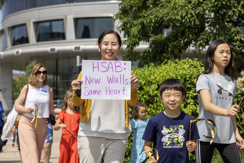 Family with signs at WenJo parade