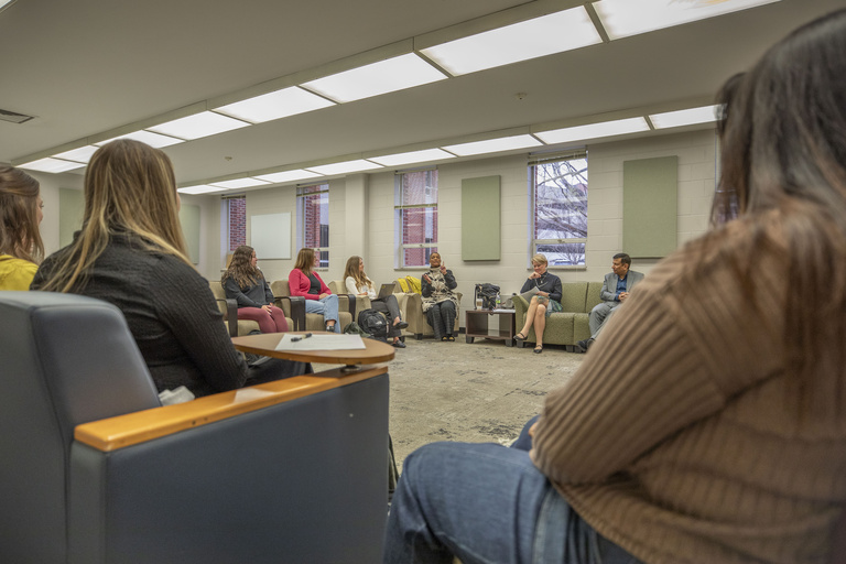 students listen to speakers