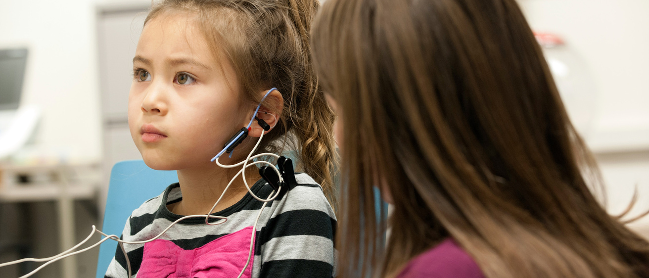 A young patient undergoing clinical testing in the Beth Walker Lab.