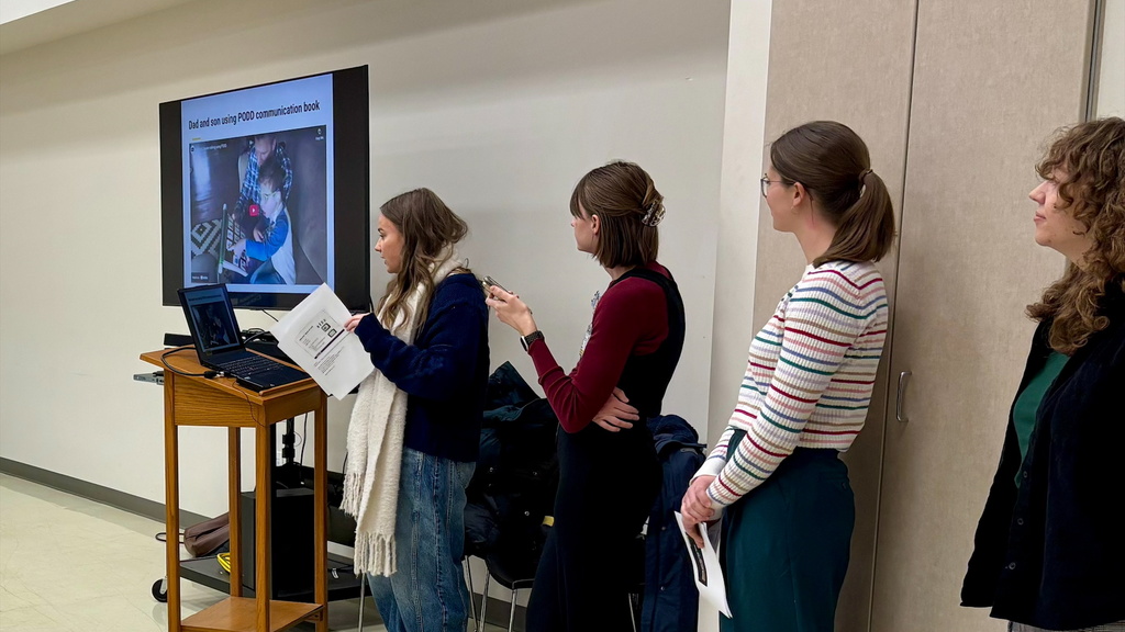 A group of SLP graduate students present to local paratransit drivers.