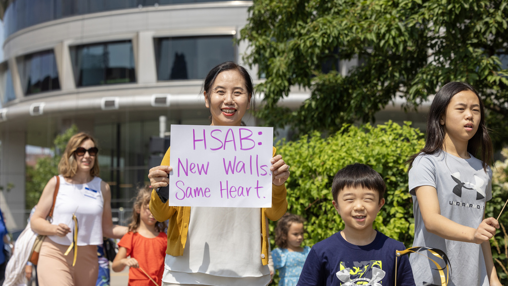 Family with signs at WenJo parade
