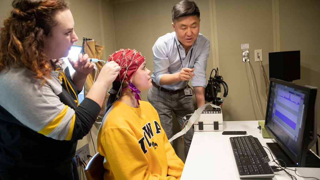 CSD students and a faculty member working in audiology lab