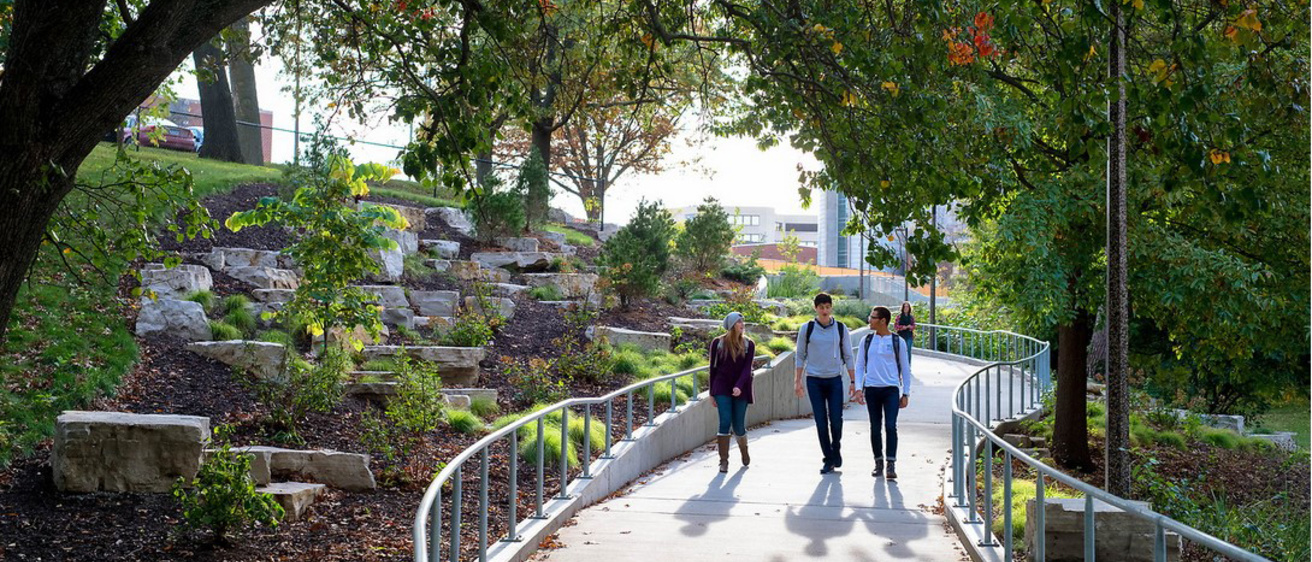 students walking on the west side of the UIowa campus