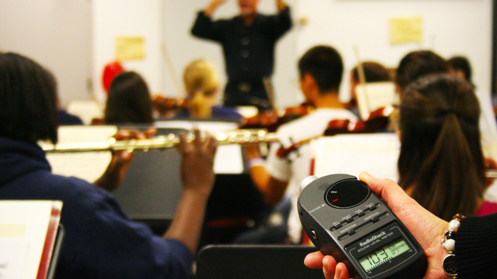 sound level meter shows 103 dB in band practice